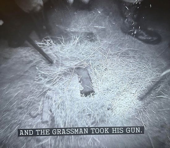 The team looking confused, over the subtitle, "The grassman took his gun!"