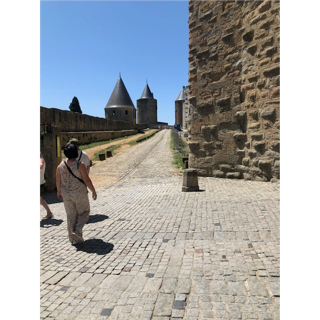 A person walking on a brick road

Description automatically generated with low confidence