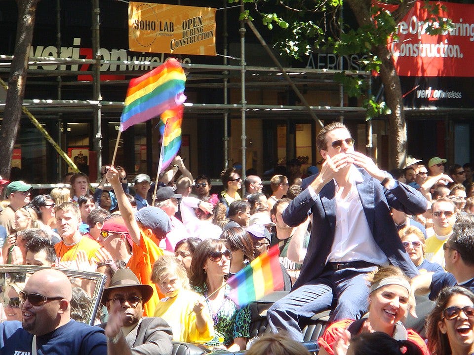 Newsom being held aloft at a 2007 gay pride parade during the early stages of his career Newsom being held aloft at a 2007 gay pride parade during the early stages of his career