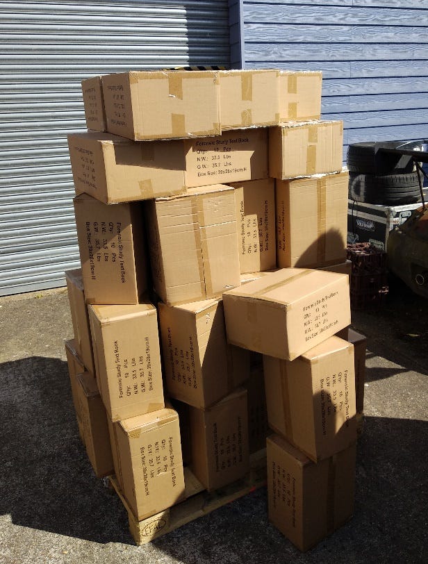A stack of cardboard boxes Description automatically generated