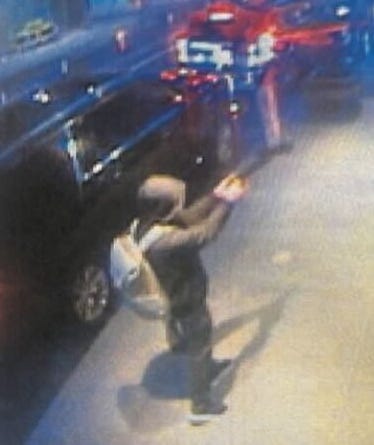 Surveillance images captured the murder suspect outside the Midtown hotel holding a gun