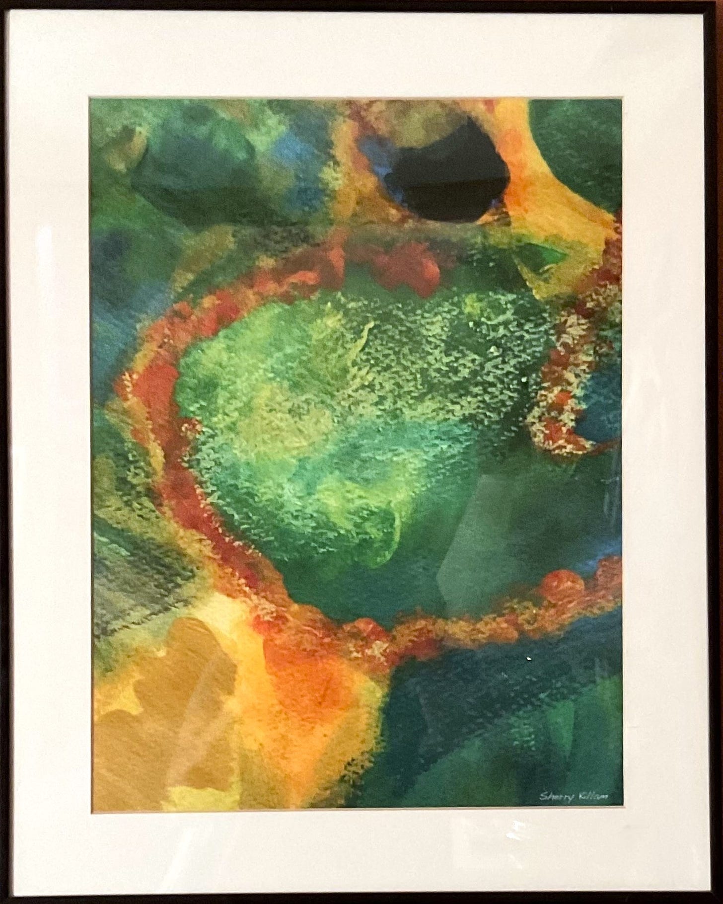 Matted and framed photo of a detail from a mixed media painting by Sherry Killam Arts suggesting a natural habitat with earthy golds and browns, and watery greens and blues.