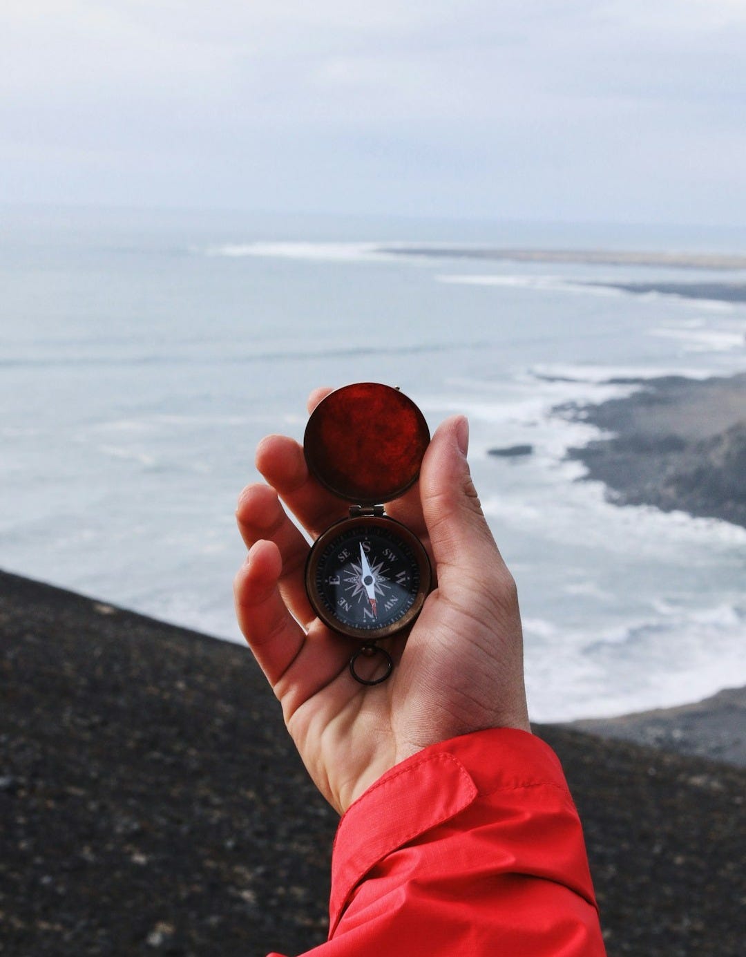 person holding compass