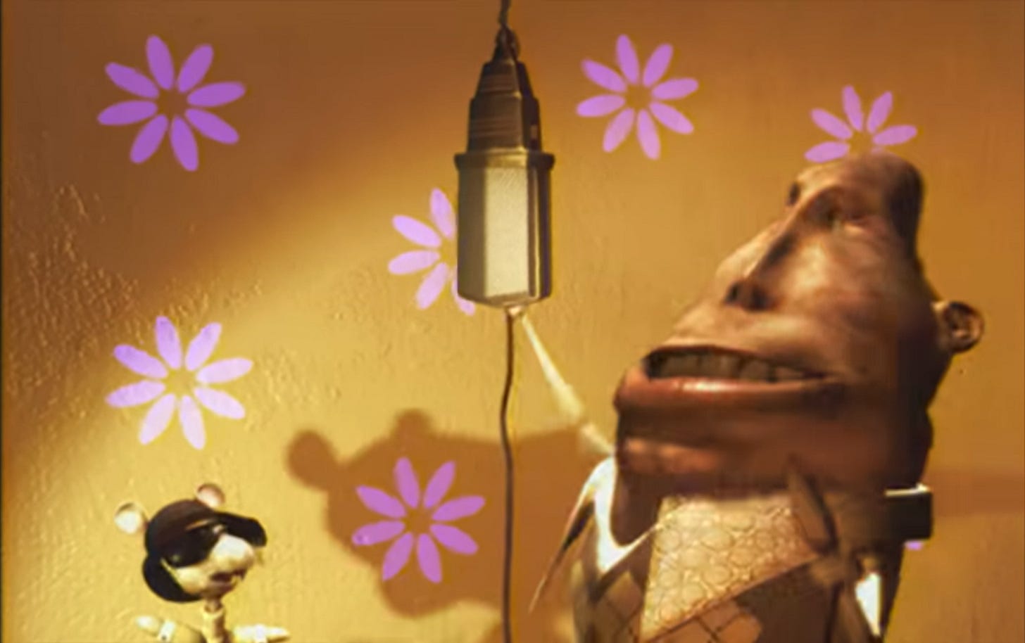 A screencap from the song Starlight by the Supermen Lovers featuring a rat (left) singing with a man whose head is shaped like a potato (right)