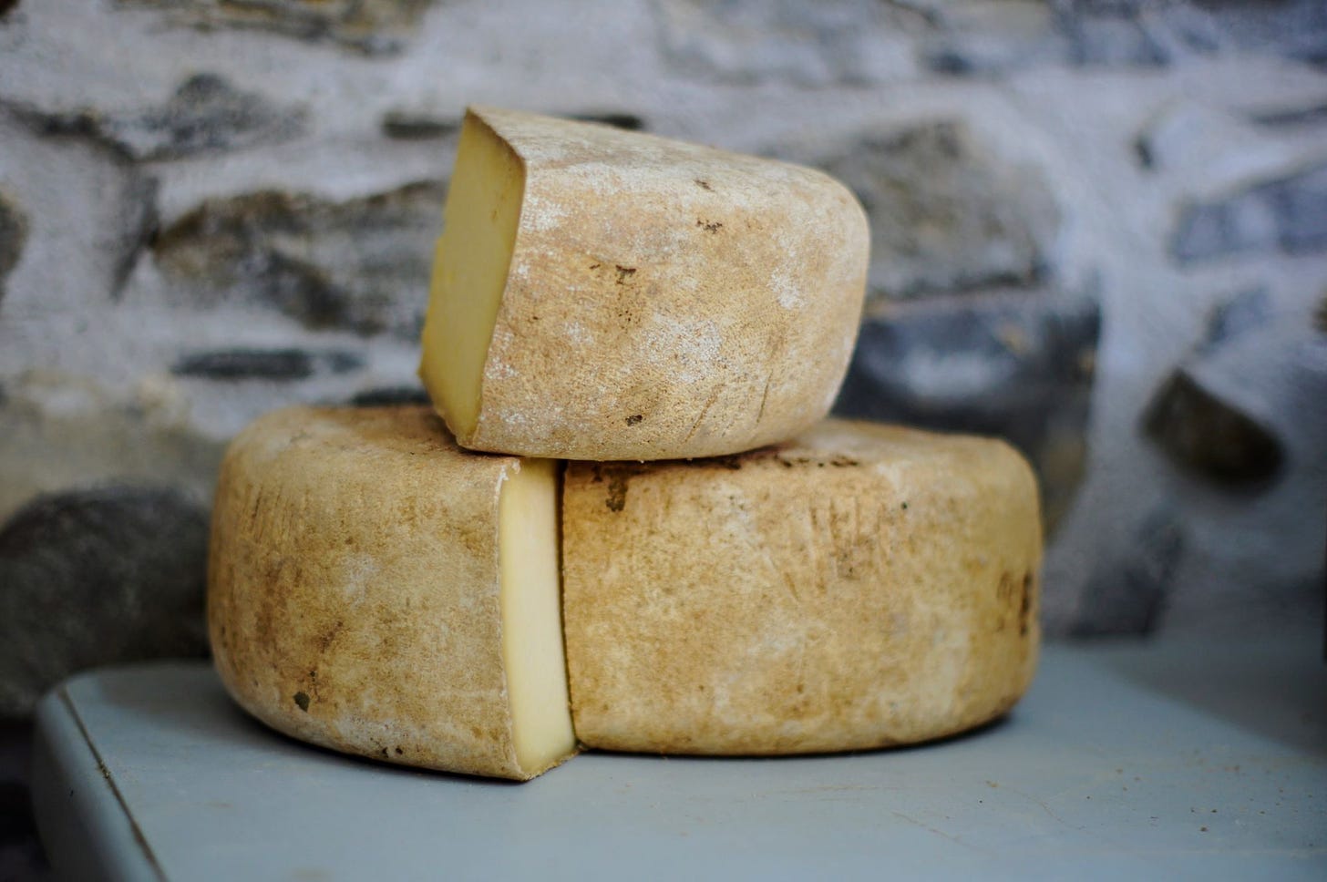 Photo of cheese via Alexander Maasch of Unsplash.