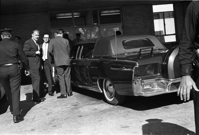 Presidential limousine outside Parkland emergency entrance with hard top fully in place. (Dallas Times Herald staff photo, 11/22/1963)