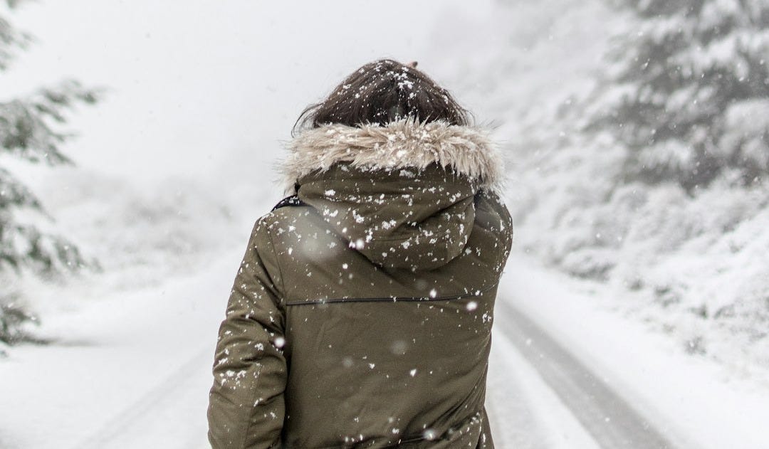 woman standing in front of road