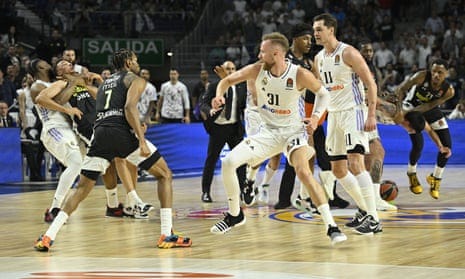 A fight breaks out near the end of Thursday’s EuroLeague playoff game between Real Madrid and Partizan at Wizink Center in Madrid, Spain.