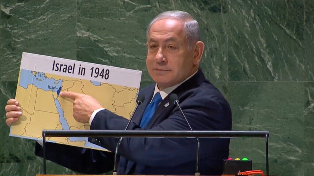 Israeli PM Benjamin Netanyahu holds up map that erases Palestine. UN General Assembly, 22 September 2023 (YouTube) Israeli PM Benjamin Netanyahu holds up map that erases Palestine. UN General Assembly, 22 September 2023 (YouTube)