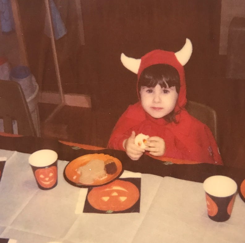 Toddler Lyric in a red-devil costume that my grandparents loved and my mother hated. My grandfather loved to tell the story of the time he and I had matching devil costumes when I was little. 