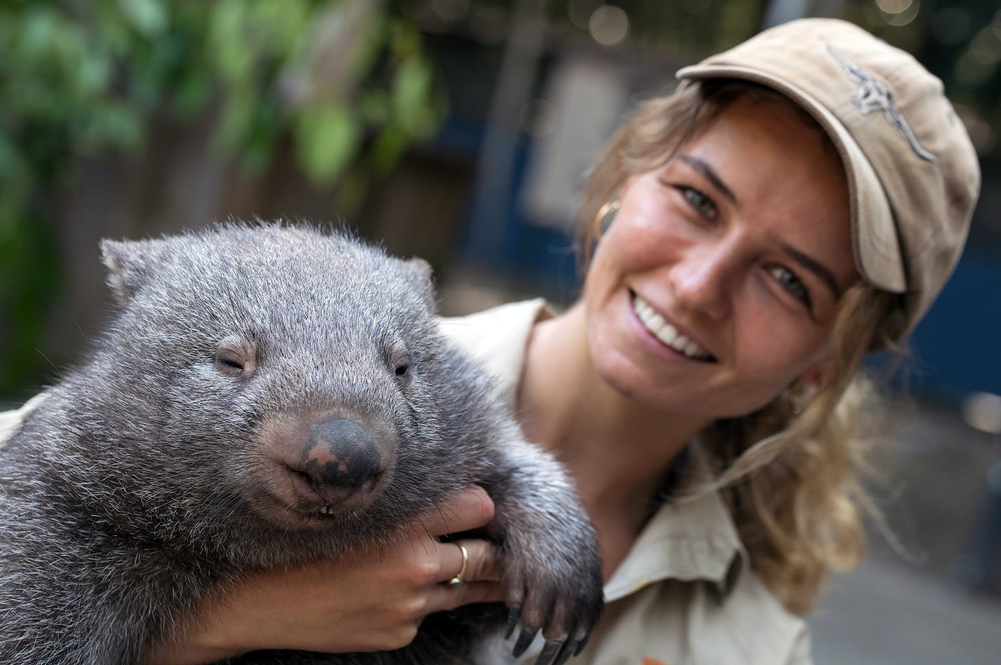 Girl holding wombat, cube shaped poo, Time2Thrive.ca