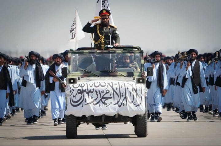 Taliban fighters in formation during a military parade.