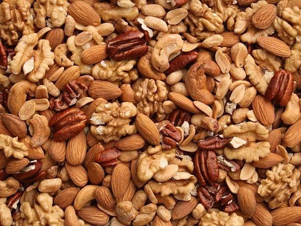 Nuts background Variety of nuts nuts stock pictures, royalty-free photos & images