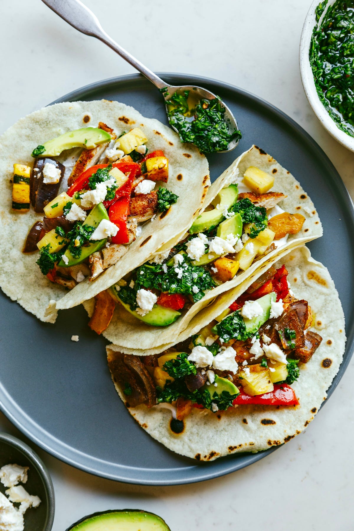 Chimichurri chicken tacos on a plate. 