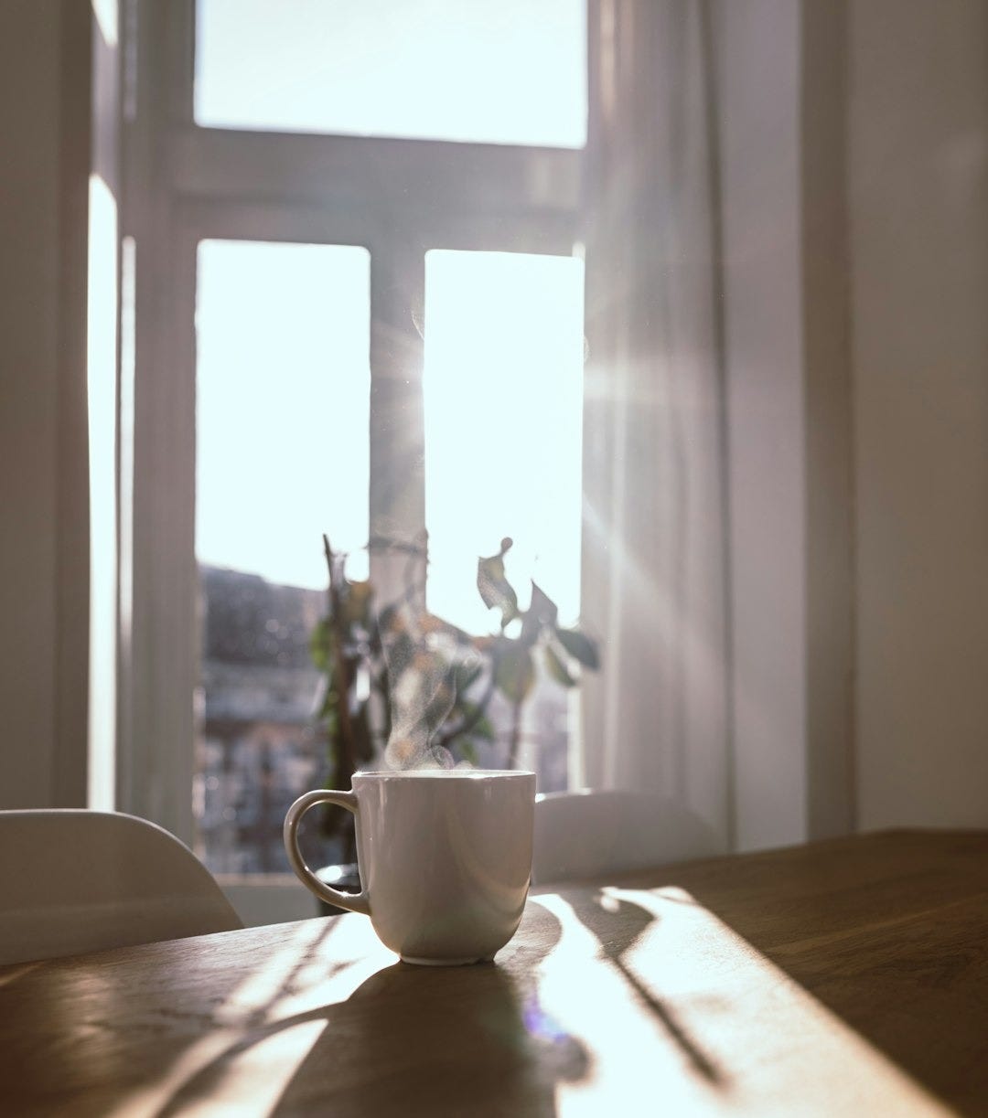 a vase sitting on top of a wooden table