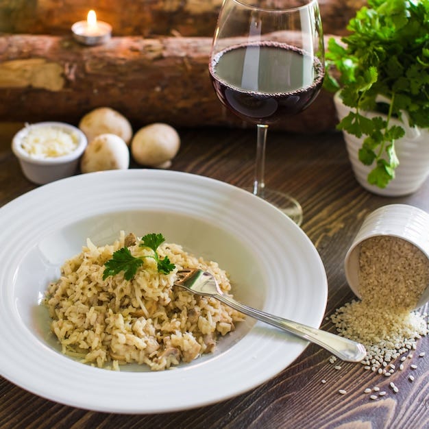 Plate of mushroom risotto topped with grated cheese