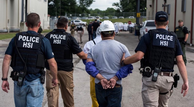 A group of police officers being arrested

AI-generated content may be incorrect.