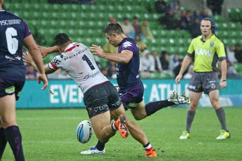 Cooper Cronk quicks a game winning field goal in the closing moments of the game   Digital Image by Brett Crockford Â©nrlphotos.com :	    NRL, Rugby League, Round 7,  Melbourne Storm v  Sydney Roosters @ AAMI Park, Melbourne, VIC, Saturday 18 April, 2015. 