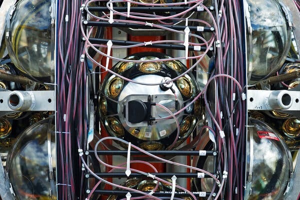 A close-up view of a very complex piece of orb-like scientific equipment, with wires and other complicated components.