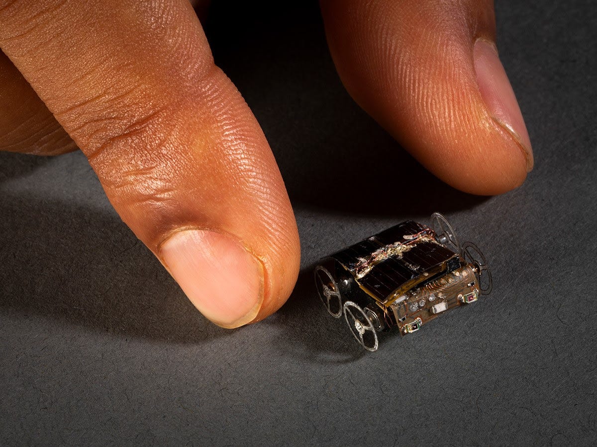 Image: Credit Millimobile. Micro robot next to hand for scale. 