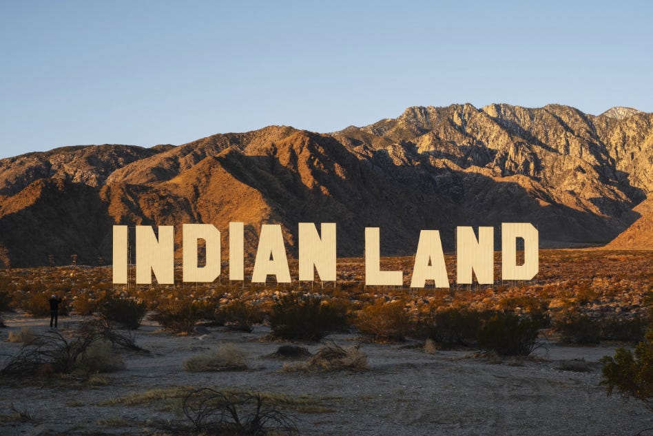 Never Forget (2021) by Nicholas Galanin reimagines the Hollywood sign, addressing land theft, colonization, and Indigenous erasure. It highlights the commodification of land and culture, reclaiming space for Native voices and asserting Indigenous sovereignty in a highly visible, symbolic location.