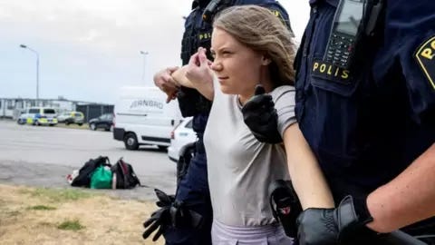 Reuters Police remove Greta Thunberg from a demonstration at Malmo port, June 2023