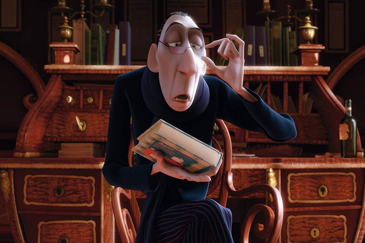 A still from the Pixar movie “Ratatouille” showing a man holding a book while peering over his glasses condescendingly.
