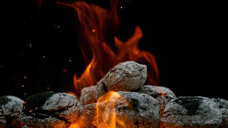 burning charcoal briquettes