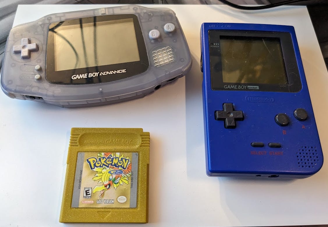 Faeore sent us some photographs of items from her childhood, around the time of hosting the website. Here is her Game Boy Advance, Game Boy Pocket, and her copy of Pokémon Gold!