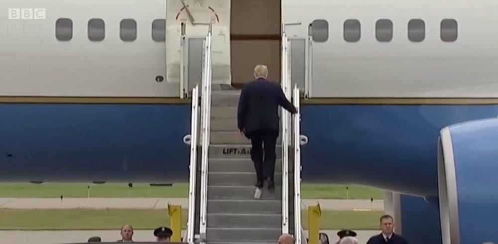 Donald Trump boards an aeroplane with toilet paper stuck to his shoe Donald Trump boards an aeroplane with toilet paper stuck to his shoe