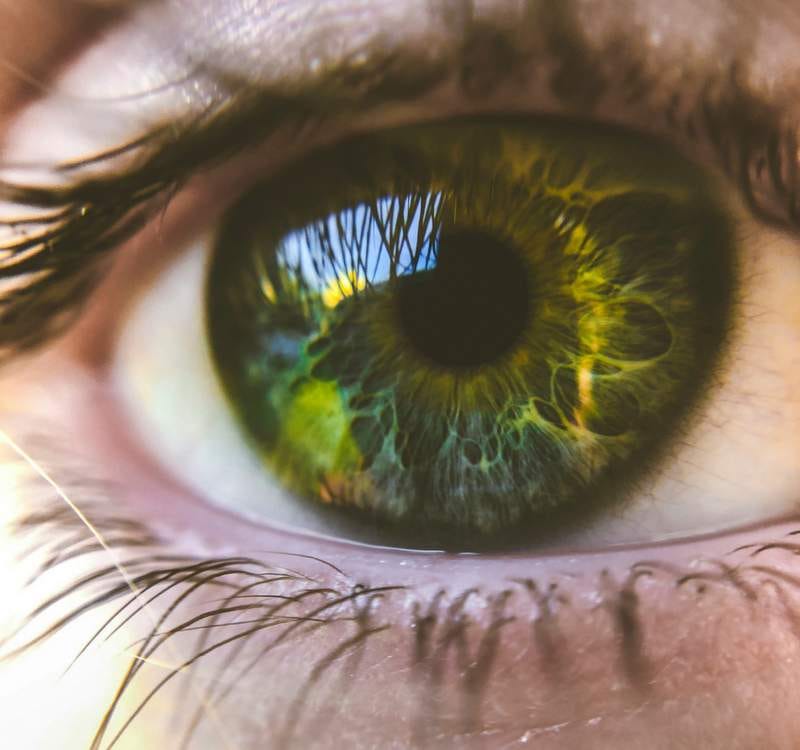 Unsplash photo of a closeup of an eye that's deep green.