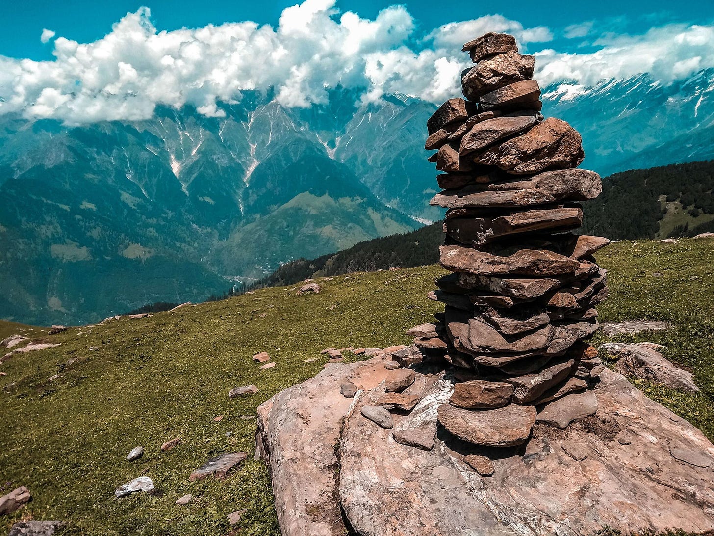 stones stacked on top of each other ona mountain