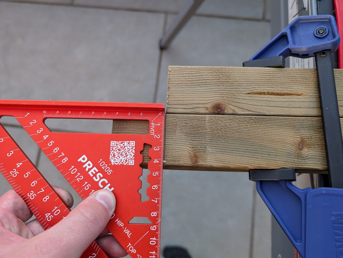 Using a carpenters square to transfer the length of one piece to another. 