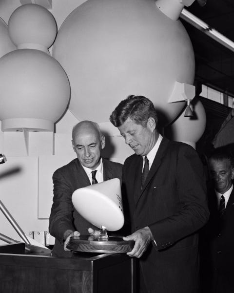 President John F. Kennedy and NASA Administrator Dr. Robert Gilruth with a model of the Apollo Command Module. NASA Rich Building, Houston, Texas. September 12, 1962. (Credit: NASA)