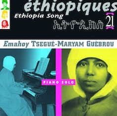 An album cover featuring a young woman in a head wrap and an elderly woman playing the piano.