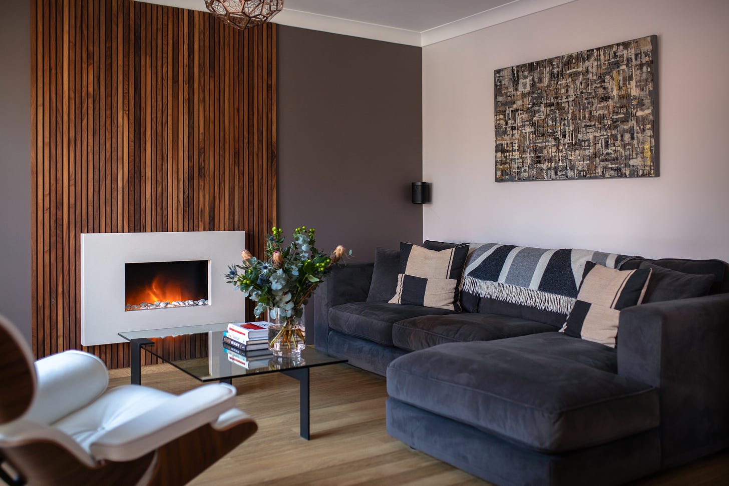 modern living room with wood panelled feature wall and minimalist decor