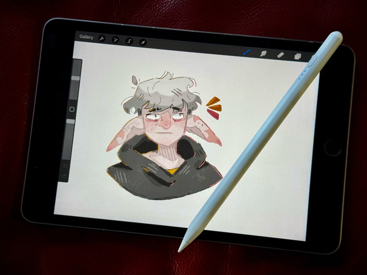 a fake Apple Pencil lies on an iPad with a picture freshly drawn