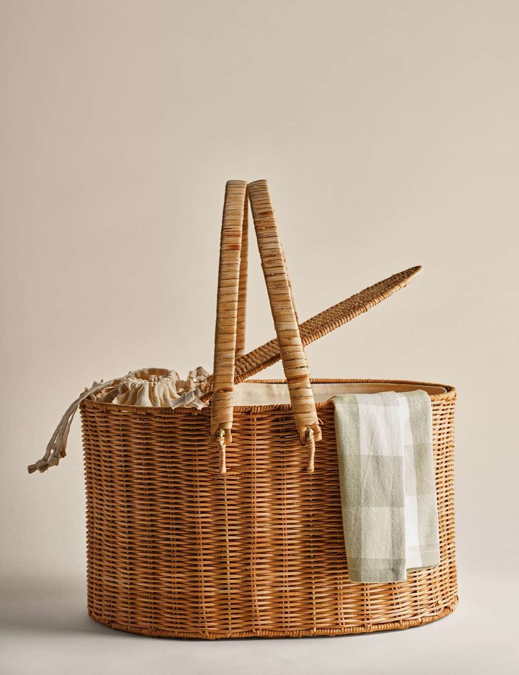 rattan picnic hamper with linen bottle holders