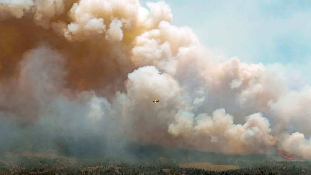 Billowing smoke, Barrington Lake, Nove Scotia as plane drops fire retardant