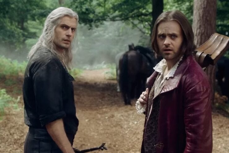 Henry Cavill as Geralt and Joey Batey as Jaskier in The Witcher