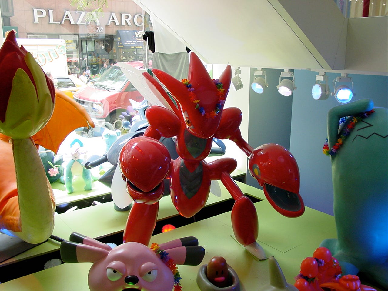 The Scizor statue inside the store’s lower floor window display. It is decorated with flowers in celebration of the store’s “Pikachu’s Vacation” event