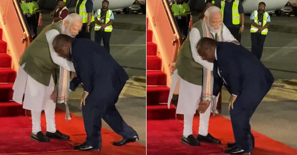 Papua New Guinea PM welcomes Modi by touching his feet