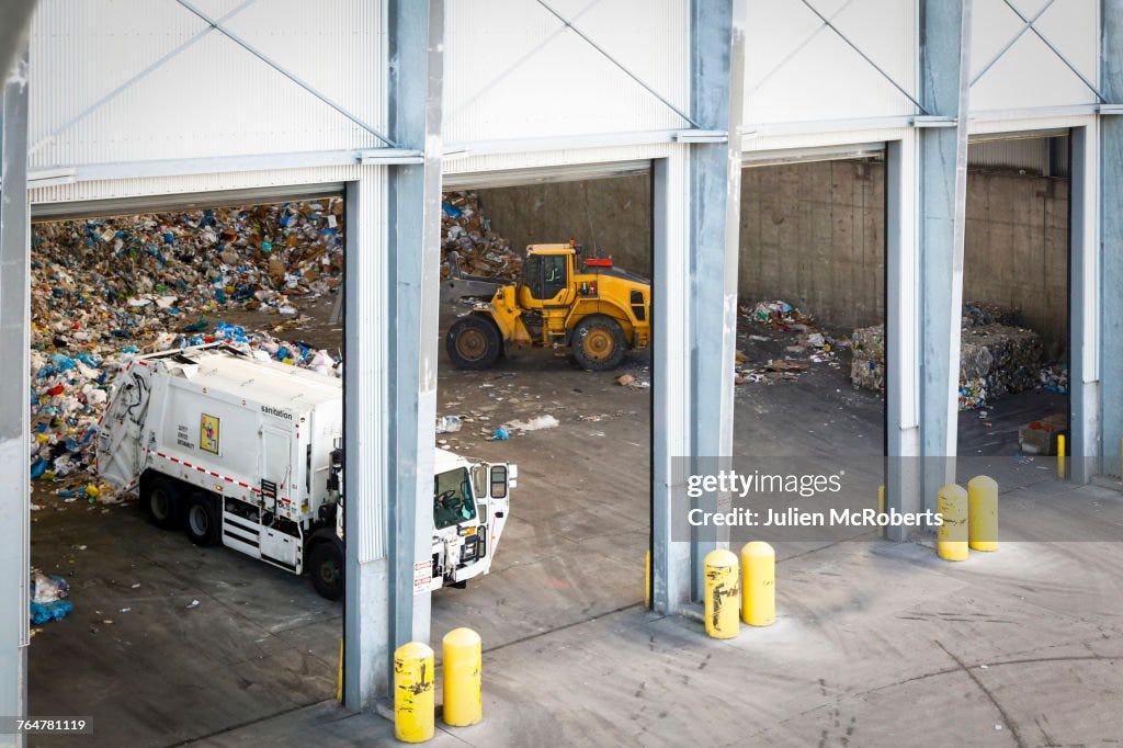Garbage Truck Unloading Trash High-Res Stock Photo - Getty Images