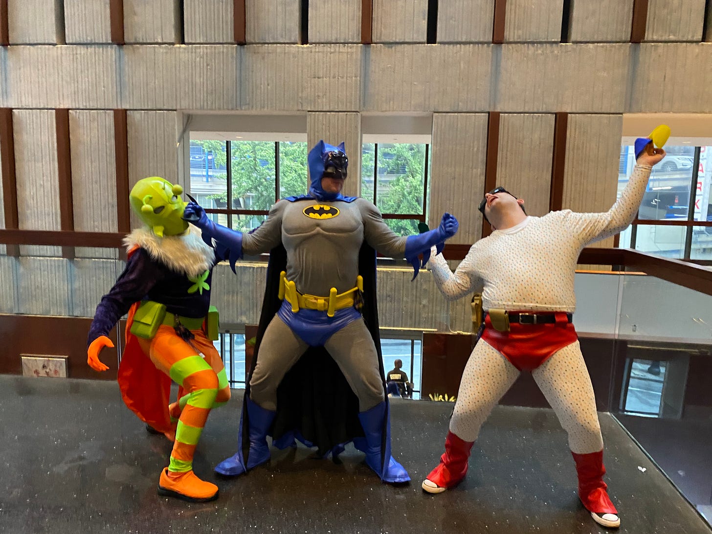 Batman punches out Killer Moth and Polka-dot Man.