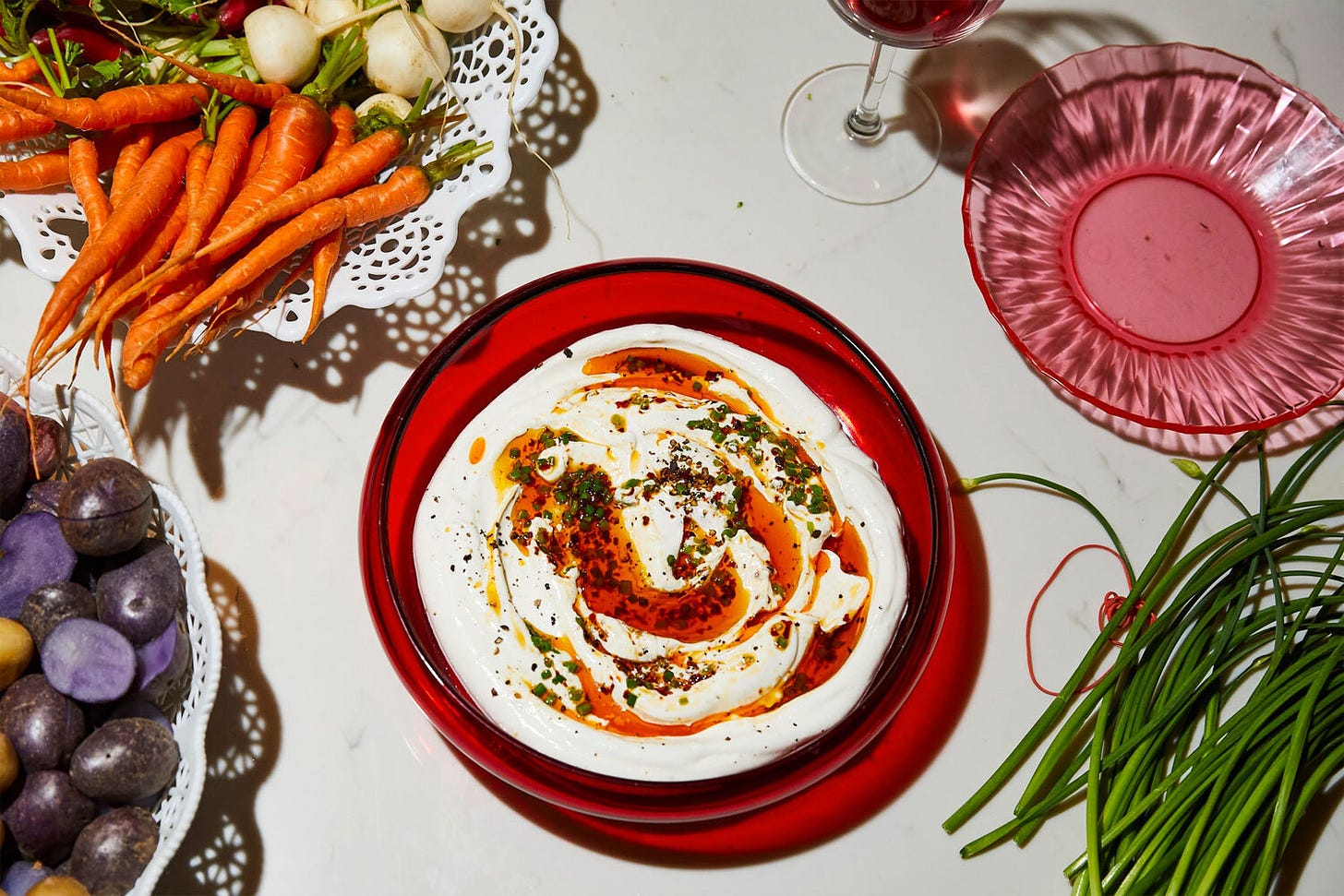 alison-roman-cooking-labneh-dip-with-sizzled-scallions-and-chile.jpg