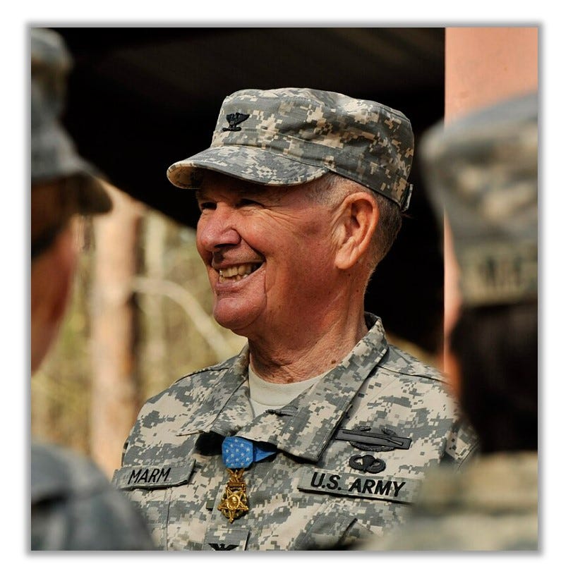 Marm in uniform. He is smiling and wearing the Medal.