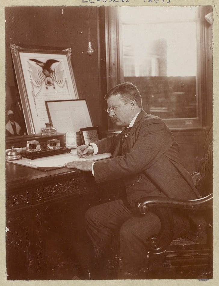 President Roosevelt signing his 1902 Thanksgiving Proclamation act