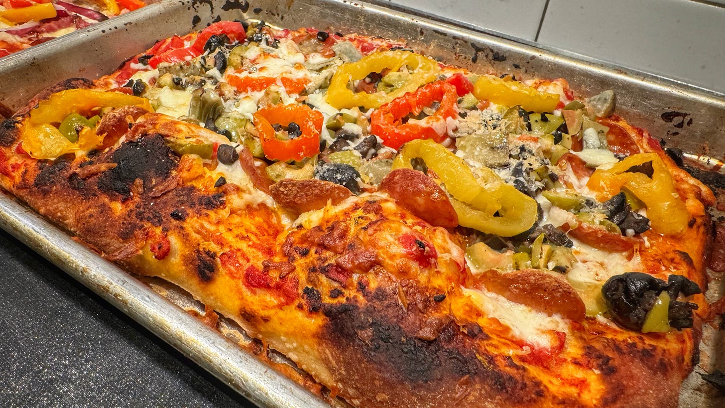 A close up view of the pepperoni and marinated veg pizza