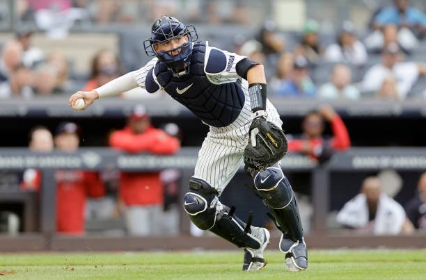 Kyle Higashioka of the New York Yankees in action against the Washington Nationals at Yankee Stadium on August 24, 2023 in the Bronx borough of New...