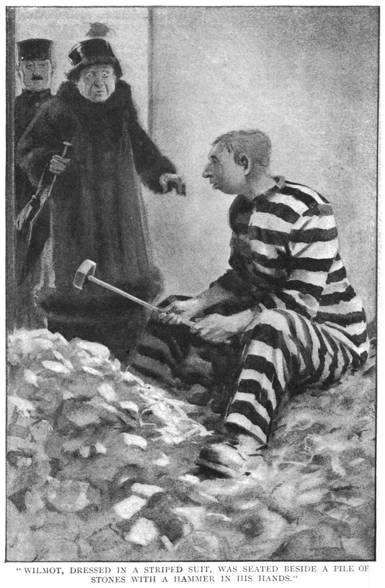 Wilmot, with aforementioned suit, stones, and hammer, as Lady Malvern looks on in shock, and a mustachioed officer displays no emotion. The caption reads, ""Wilmot, dressed in a striped suit, was seated beside a pile of stones with a hammer in his hands.""